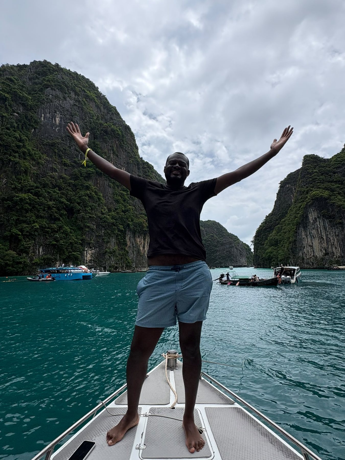 Traveler celebrating aboard a boat in the Phi Phi Islands